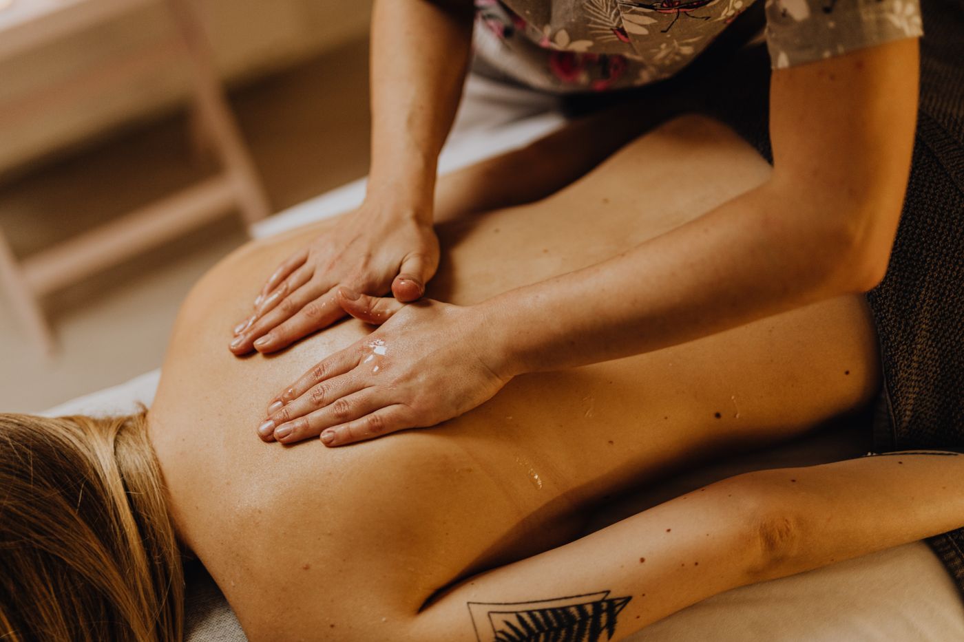 A therapist gives a Balinese-style back massage